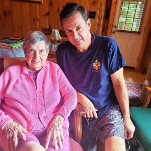 Relaxing in their summer cottage on Sokokis Lake in Limerick, Maine, are 101-year-old Madeline Grace Gould Armstrong and her nephew, Shawn Buckless. (Saugus Advocate photo by Mark E. Vogler)