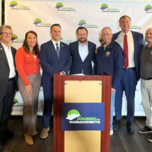 Pictured from left to right: Ward 4 Councillor Paul Argenzio, City Council President Anthony Zambuto, Revere Zoning Board Member Peggy Pratt, Mayor Patrick Keefe, Housing for Massachusetts campaign committee Chair Conor Yunits, Ward 2 Councillor Ira Novoselsky, State Rep. Jeffery Turco, Councillor at-Large Marc Silvestri and School Committee Member Alex Rhalimi.