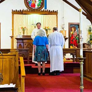 Rev. John Beach and his wife Denise Beneteau receive blessings for their future endeavors from Rev. Canon Gregory Perez. (Photo courtesy of Julia Aston)