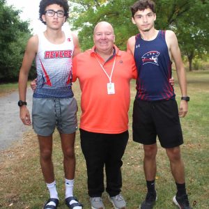 CROSS-COUNTRY: Shown from left to right: senior Youness Chahid, Head Coach Mike Flynn and senior Steven Espinal during a recent meet against Lynn Classical High School at Belle Isle Marsh Reservation.