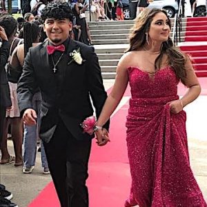 The “Red Carpet” part of Prom Night, where promgoers arrive at the school and walk down the stairs before an admiring crowd, is one of the highlights of the year. It takes place at the front of Malden High School at 4:00 p.m. Above: Class of 2023 senior Ronald Juarez walked the Red Carpet with his date. (Advocate Photo)