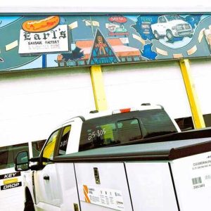 SAUGUS DOESN’T RECOGNIZE THIS AS ART: This mural at Cap World Truck Accessories & Trailers that pays homage to Route 1 is classified as a nonconforming sign that was “grandfathered” in. Current town zoning bylaws do not make a distinction between signage and murals. (Gabriella Galbadis photo to The Saugus Advocate)