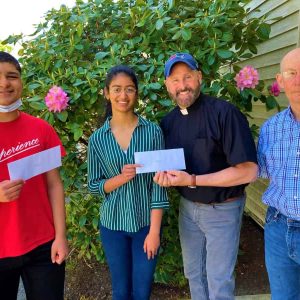 Left to right: Pioneer Charter School of Science II graduating seniors Omar Ally and Neva Matthews receive their Danny Panico Memorial Scholarship Awards from Rev. Bill Ladd and Carl Spencer – both of First Congregational Church-UCC of Saugus. (Courtesy photo to The Saugus Advocate)