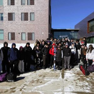 SKI SLOPE-BOUND STUDENTS: A $10 donation by WIN Waste Innovations has again helped pay most of the transportation costs of five ski trips for the Saugus Middle-High School Ski and Board Club. Holding skis in the front is Jill Lauziere, a parent who organized the ski trips. To her right is WIN Waste Innovations Saugus Plant Manager Elliott Casey. Please see the story in this column. (Courtesy photo of PKH Communications)