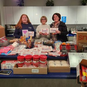 SORTING THROUGH THE DONATIONS: Local DAR members Wendy Renda, Gail Cassarino and Jaclyn Cassarino Smith recently assembled much-needed supplies for delivery to USO New England at Logan Airport. (Courtesy photo to The Saugus Advocate)