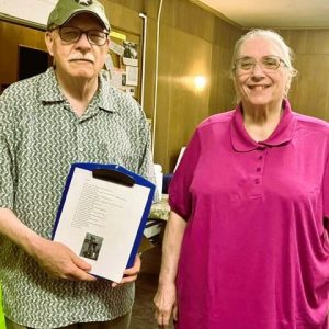 SPREADING LOVE AND PEACE: Congregation Ahavas Sholom synagogue’s President of the Sisterhood, Maureen Appel (right) with Guest Speaker Rev. Dr. Robert G. Leroe, a retired Army Chaplain, holding the poem “ONE,” which he read last week during a remembrance of Sept. 11, 2001. (Courtesy Photo of Joanie Allbee)