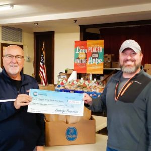 SUPPORTING THE FOOD PANTRY: Angelo Serino (left) recently presented a check for $2,000 from the Cummings Foundation to Pastor Joseph W. Hoyle of Cliftondale Congregational Church for use at the Saugus United Parish Food Pantry. This is the second year that Serino, a Saugus resident, nominated the food pantry for a Cummings Foundation grant. The Cummings Foundation again recognized the good work being done by volunteers at the food pantry. (Courtesy photo to The Saugus Advocate)