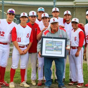 WE LOVE YOU, BOB! The Saugus Sachems Baseball Team shows appreciation to World Series Park Superintendent Bob Davis for tenacious and tireless efforts to bring nighttime baseball to Saugus. Surrounding Bob Davis are the Saugus Sachems baseball team members of the Class of 2022: Nathen Ing, Ryan Anderson, Anthony Macone, Sean O’Rourke, Michael Howard, Matt MacEachern, Ryan Mabee, Anthony Cicolini, David Turilli and Drew Gardner. The senior players will be honored today in a ceremony before their final home game, set for 4 p.m. at World Series Park. (Courtesy photo to The Saugus Advocate)