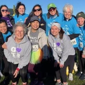 Salemwood K-8 School Principal Van Huynh (first row, first at left) and the “Girls on the Run” and “Heart and Sole” coaches are shown at Suffolk Downs for the 5K race. (Courtesy Photo/Salemwood School)