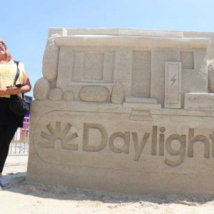 Saugus resident Deborah Barrett-Cutulle was hired to do this sponsored sculpture at last weekend’s 2025 Revere Beach International Sand Sculpting Festival. She was also a judge. (Saugus Advocate photo by Tara Vocino)