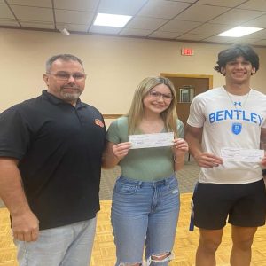 Everett Crimson Tide Pop Warner Board of Directors President Brian Dimond with scholarship recipients Chelsi Dimond and Giacobbe Ward.