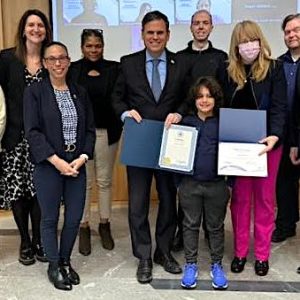 The Malden School Committee honored Linden school first-grader Maximus Angel at Monday’s regular meeting. Pictured above, from left, are committee members Sharyn Rose-Zeiberg (Ward 7), Elizabeth Hortie (Ward 5), Vice Chair Jennifer Spadafora (Ward 3), Dawn Macklin (Ward 4), School Committee Chairperson/Mayor Gary Christenson and Robert McCarthy Jr. (Ward 2), Maximus Angel, Superintendent Dr. Ligia Noriega-Murphy, committee member Keith Bernard (Ward 7) and Linden STEAM Academy Principal Rafael Garcia. (Advocate Photo/Henry Huang)