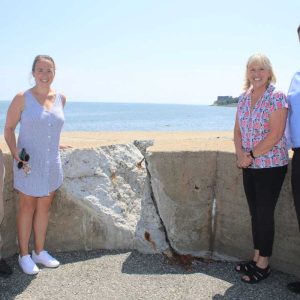 Shown from left to right: Policy District Director for Democratic Whip Katherine Clark Wade Blackman, District Director for Democratic Whip Katherine Clark Kelsey Perkins, Ward 1 City Councillor/City Council President Pro Tempore Joanne McKenna and State Representative Jeffrey Turco discussed the effects of coastal flooding along the seawall in Beachmont last Thursday morning.