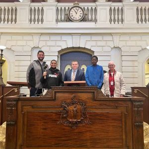 Senator DiDomenico with students and staff from Devens School in Senate Chamber