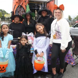 NEVER TOO OLD: Revere Senior Center staff, shown from left to right: Mina Canas, Anna Picardi and Debbie Peczka DiGiulio, dressed as witches, with Luna Linares, 4, as Wednesday from the Addams Family, Lea Linares, 8, as Cinderella, Tammy Linares, 8, as Elsa, and Francesca Linares, as Casper the Friendly Ghost.