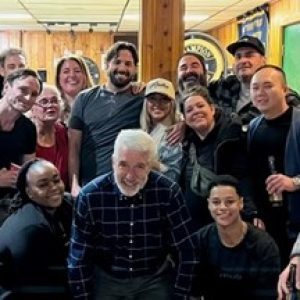 The gangs all here after the ceremony: Dave (back, middle with beard) surrounded by friends, fellow officers and family, including his famous pops, Joe (pictured front and center) with that great head of gray moss.