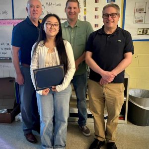 Pictured from left to right: Shown with winner/student Kailey Bae are StonehamBank Vice President/Business Development Shawn Kelley, Vice President/Commercial Loan Officer Christopher Macomber and Assistant Vice President/Loan Systems Administrator Rob Berkovitz. (Courtesy photo)