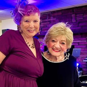 Sharon Genovese (left), who celebrated her 70th birthday party last Saturday night at the Knights of Columbus, savored the moment with her friend Ruth Berg. (Courtesy photo of Joanie Allbee)