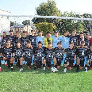 The RHS Patriots Boys Soccer Team, shown from left to right: Bottom row: Kaue Alves, Gustavo Santos, Leonardo Andrade, Luis Silva, Santiago Velez, Brayan Medina, Angel Ortez, Noah Gaviria, Nicolas Morgira and Francisco Navarette; top row: Head Coach Manny Lopes, Assistant Coach Christian Mancia, Jared Romero, Romeo Landaverde, Jeremy Romero, Eric De Carvalho, Patrick Valentim, Cristian Flores, Maicol Pomar, Daniel Espinosa, Malek Sakhri, Adin Lozich, Besmir Collaku and Nicolas Ruiz with Assistant Coaches Samuel Ochoa and Gerardo Rodriguez.