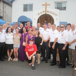 The Gennetti family members joined San Rocco Society members. Shown front row, from left to right, are: Dick Barricelli, Sheldon Mover, Joyce Mover, Maria Gennetti, Carla Gennetti, Dina Gennetti, Lisa Gennetti Lipani, Mayor Gary Christenson, Michael Cagno, and Dom Fermano. Second row, shown from left: Sheila Fermano, Paul Condon, Anthony Spadafora, Salvatore Gennetti, and Paula Cagno Maddaleni. Third row, from left: Roberto DiMarco, Bill Settemio, Darren Svendsen, Nick Menkello, Paul Condon, Jr., Gina Spadafora, Nico Spadafora, and Peter Caso. Kneeling: Rob Gennetti.