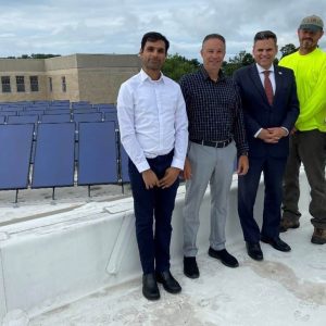 Pictured from left to right: Green Communities Regional Coordinator Dillan Patel, Malden Public Facilities Director Eric Ruben, Mayor Gary Christenson; New England Solar Hot Water Owner/Engineer Bruce Dike and National Grid representative Lori Timmerman. (Courtesy photo)