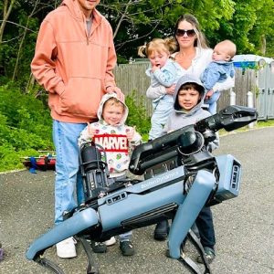 Spot the Robotic Dog, who assists Boston Dynamic, is multifunctional and greeted the family of Eric Kermelewicz: Eric, son Jaxon in front of him, Nicole McDonald holding baby Mia and baby Nicky and son Anthony in front of her. (Courtesy Photo of Joanie Allbee)