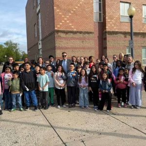 Ferryway Assistant Principal Erika Israelson (far left), Ward 1 Councillor Peg Crowe (back row, third from left), Mayor Gary Christenson (center), students, parents and teachers arrive at the Ferryway School. (Courtesy photo)