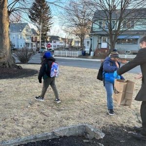 Students assist Mayor Christenson in picking up trash. (Courtesy of the City of Malden)