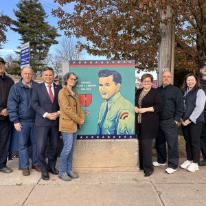 Pictured from left to right: City Council President Steve Winslow (Ward 6); Veterans’ Services Officer Kevin Jarvis; Mayor Gary Christenson; Artist Paige Wallis; Mary Ann Boari, Mr. Dempsey’s daughter; Doug Boari, Mary Ann’s husband; Suzanne Leslie, Mr. Dempsey’s niece; and William Dempsey, Mr. Dempsey’s grandson. (Courtesy photo)