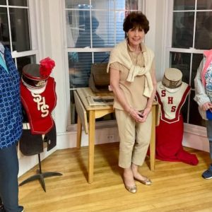 TALENTED MUSICIANS: Saugus Historical Society member Nancy Sayles, a former orchestra viola player of her former hometown band of Pound Ridge, N.Y.; Ellie Mitchell Collins, Jerome Mitchell’s daughter; and one of Mitchell’s former band members; and French horn player Janis Long, also a Saugus Historical Society member, view the Saugus High Band exhibit. (Courtesy photo to The Saugus Advocate by Joanie Allbee)