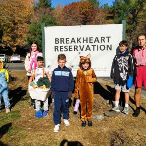 THE HALLOWEEN RUNNERS: Left to right: Imrane Rahou, Santino Diciero, Naomi Tarantino, Xavier Mazariegos-Darnell, Liam Marcu, AJ Diciero, Luiz Sena and Coach Steve Boudreau did a special fun run last Saturday (Oct. 26) at Breakheart Reservation, dressed in Halloween costumes. They are members of Coach Chris Tarantino’s Elementary School Cross Country team that attends the Belmonte STEAM Academy. Coach T.’s daughter Naomi, who is now in the seventh grade, helps out as a mentor while Coach Boudreau is the assistant coach. (Photo Courtesy to the Saugus Advocate)