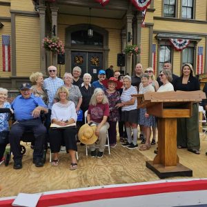 THE MAIN EVENT: Town officials and past recipients of the Founder’s Day “Person of the Year Award” gathered on a stage set up near the steps of Saugus Town Hall last Saturday (Sept. 8) for the presentation of this year’s honorees: Gail Cassarino and Jack Klecker. (Saugus Advocate photo by Mark E. Vogler)
