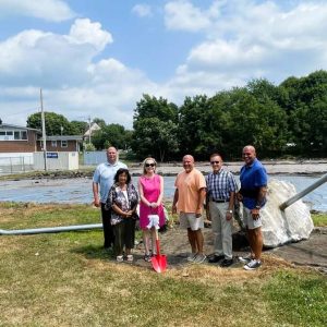 THE WORK BEGINS: Town Manager Scott C. Crabtree and Selectman Corinne Riley, Board of Selectmen Chair Debra Panetta with the ceremonial shovel and Selectmen Jeff Cicolini, Mike Serino and Anthony Cogliano gather at Anna Parker Playground to celebrate the start of Anna Parker Playground improvements. (Courtesy photo to The Saugus Advocate)