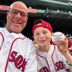 This picture is at Fenway Park the time Ceddanne Rafaela threw young Gavin (right) a baseball; father Tony (Howard) is on the left.