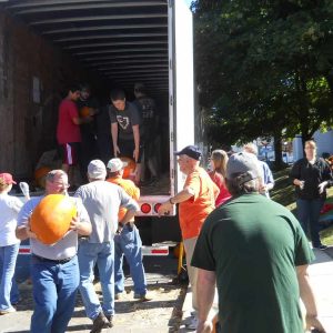 THE PUMPKIN BRIGADE: Church members and community volunteers from a previous year are shown unloading “The Pumpkin Truck.” Volunteers are needed. Pumpkins of all sizes will be available for purchase at the First Congregational Church Pumpkin Patch in Saugus Center starting Sept. 23. (Courtesy photo to The Saugus Advocate)