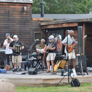 The audience “had big fun” enjoying zydeco music at the first concert of the season with the Squeezebox Stompers on the upper lawn of the Saugus Iron Works National Historic Site. (Courtesy photo to the Saugus Advocate by Laura Eisener)