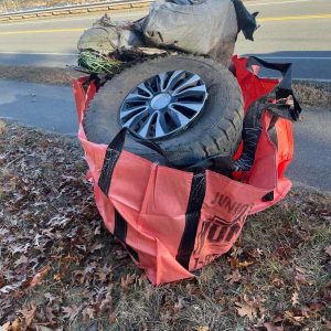 This bag of tires and other junk was part of the litter cleaned up at Walnut Street on Nov. 29. (Courtesy photo to The Saugus Advocate)