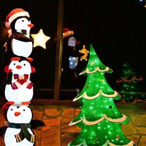 This stack of penguins is just tall enough to place the star atop the tree at Kowloon. (Photo courtesy of Laura Eisener)