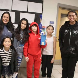 Shown from left to right: Ace Thou, parent Gerrilee Thou, first grader Kailani Thou, sixth grader Navianna Thou, sixth grader/Artist RJ Cambria, fourth grader Kai Thou and eighth grader Cortez Thou.