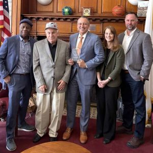 Pictured from left to right: Triangle, Inc. staffer Gamelin Bernier, Triangle client Dennis, State Representative Aaron Michlewitz and Triangle staffers Rachel Kaprielian and Drew Warren.