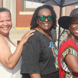 Shown from left to right: spoken word poet Michelle La Poetica, National Anthem singer Martina Campbell and guest speaker Nicole McClain.