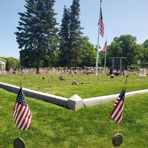 VETERANS’ GRAVES FLAGGED: Riverside Cemetery was a sea of red, white and blue during Memorial Day weekend last year. Dozens of volunteers are expected to gather in the cemetery at about 3:30 p.m. today (Friday, May 24) to assist grave officer Randy Briand in planting miniature American flags at the graves of veterans. (Saugus Advocate file photo by Mark E. Vogler)