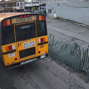 A security camera catches a school bus allegedly hitting the fence as it heads towards Broadway from the rear of 354 Broadway. The property owner is seeking the identity of the school bus driver and the city’s relationship with the company. (Courtesy of Dr. Randall Bock)