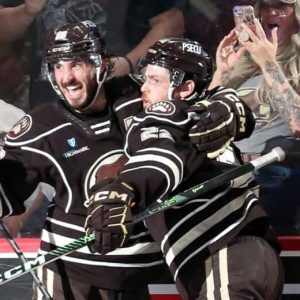 Saugus native Mike Vecchione of the AHL’s Hershey Bears is shown celebrating his overtime goal with a teammate during the first game of the Eastern Conference finals against the Cleveland Monsters on May 30. The Bears won the game, 5-4. The defending Calder Cup champs also won game two in overtime, 3-2 last Saturday night. (Courtesy photo / American Hockey League)