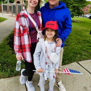 WAITING FOR THE PARADE: Sarah Batchelder, her husband Mark Parker and their seven-year-old daughter Scarlet Batchelder. (Saugus Advocate Photo by Mark E. Vogler)