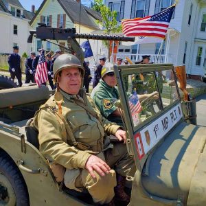 WEARING TWO HATS: David Savoie, acting chaplain for the Saugus Veterans Council, also participated in the 2019 Memorial Day Parade and ceremony as a World War II reenactor – riding in the jeep when he wasn’t presiding over prayers. (Saugus Advocate file photo by Mark E. Vogler)