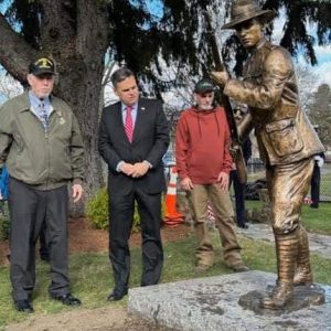 WORLD WAR I REPLICA: From left: Veterans’ Services Officer Kevin Jarvis, Mayor Gary Christenson and Cemetery Director Chris Rosa check out the newly unveiled World War I replica statue at Devir Park in Malden. (Advocate Photo)