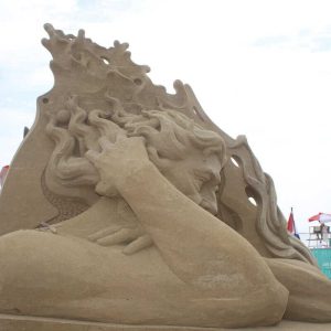 Last year’s winner, “Neptune’s Morning Coffee,” by Slavian Borecki of Poland, won first place in the 2023 Revere Beach International Sand Sculpting Festival.  (Advocate file photo)