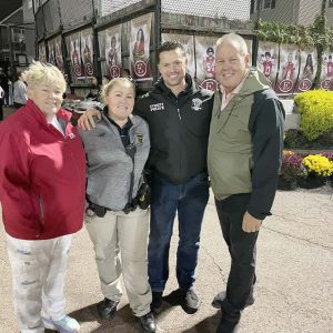 Superintendent William Hart and School Committee Chairperson Jeanne Cristiano are pictured with Student Resource Officers Janelle Grasso and Det. Stephen Ramunno and EHS cheerleader Emma Perry on Friday, September 20 vs. Xaverian.