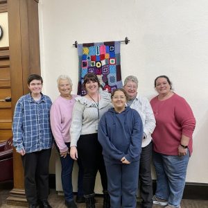 Representatives from the Parlin Yarn Club and Eliot Family Resource Center, shown from left to right: Evelyn Gayhart, Pat Albano, Victoria Strand, Meryem Ikouassen, June DeYoung and Eleanor Gayhart.